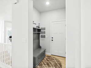 Mudroom featuring wood-type flooring