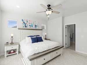 Master Bedroom. Bedroom featuring light carpet and ceiling fan