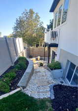 View of yard with a balcony