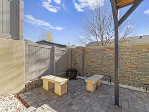 View of patio featuring an outdoor fire pit