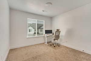 Office area featuring carpet floors