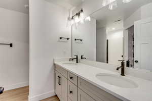 Bathroom featuring vanity and hardwood / wood-style flooring