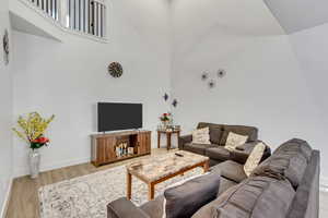 Living room with light hardwood / wood-style floors