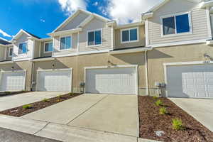 View of property with a garage