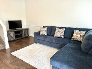 Living room with wood-type flooring