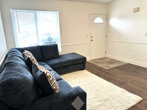 Living room with hardwood / wood-style flooring