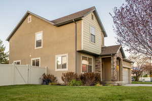 Exterior space with a lawn and a garage