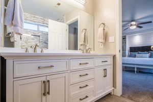 Bathroom featuring vanity and ceiling fan