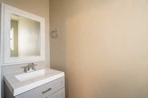 1/2 guest bathroom featuring vanity