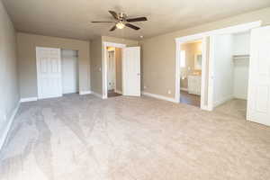 Ensuite bedroom with a new carpet, ceiling fan, and ensuite bathroom, 2 closets one is a walk in.