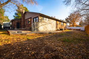 Back of house with central AC unit