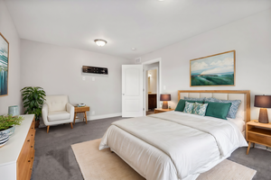 Bedroom with dark colored carpet