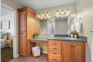 Bathroom with tile patterned flooring and vanity