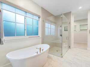 Bathroom featuring plus walk in shower