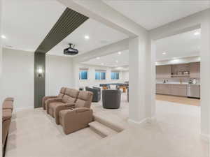 Living room with sink and light colored carpet