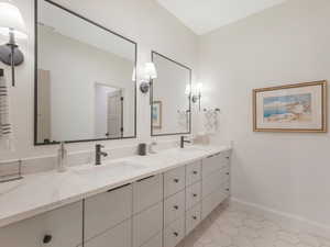 Bathroom featuring tile patterned floors and vanity