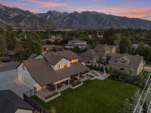 Aerial view at dusk featuring a mountain view