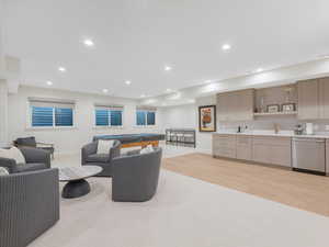 Living room with light wood-type flooring, sink, and billiards