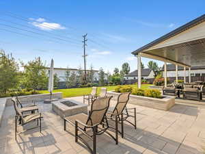 View of patio featuring an outdoor fire pit