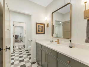 Bathroom with an enclosed shower, vanity, and toilet