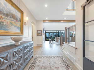 Hallway with light hardwood / wood-style floors