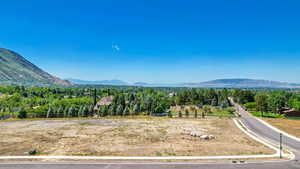 Property view of mountains with a rural view