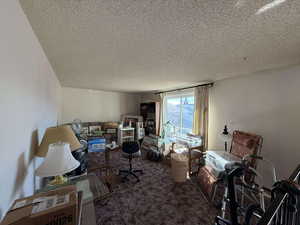 Interior space featuring a textured ceiling