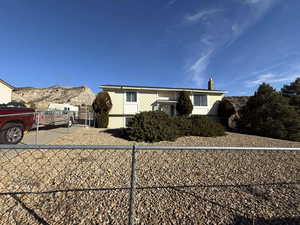 View of front of home featuring a mountain view