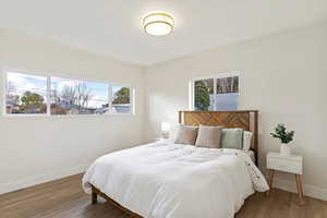 Bedroom with wood-type flooring