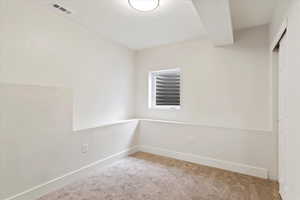 Spare room with light colored carpet