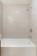 Bathroom with tiled shower / bath