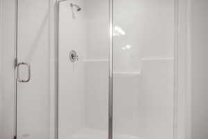 Bathroom with a shower with door