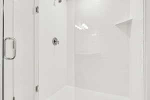 Bathroom with a shower with door