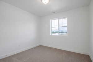 Empty room with carpet floors