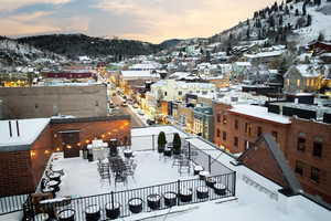 Snowy aerial view featuring a mountain view