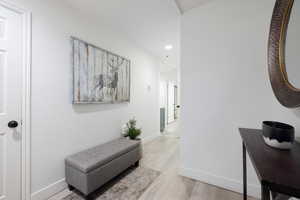 Hallway with light wood-type flooring