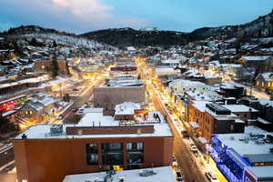 Snowy aerial view with a mountain view