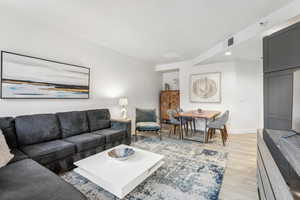 Living room with light hardwood / wood-style flooring