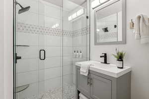 Bathroom with vanity and walk in shower