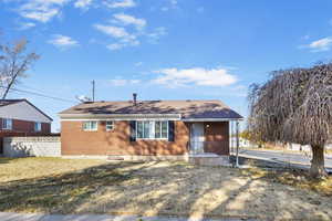 Single story home featuring a front yard