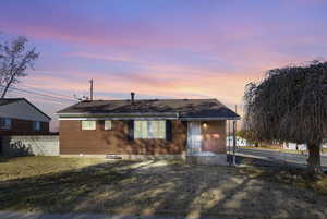 Ranch-style house with a yard