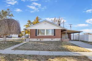 View of front of property with a carport