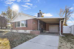 Ranch-style home with a carport