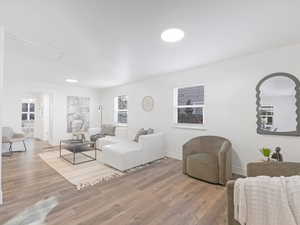 Living room with hardwood / wood-style floors