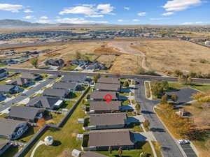 Birds eye view of property with a mountain view