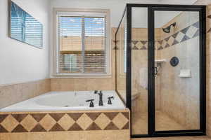 Bathroom featuring independent shower and bath