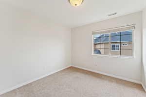 View of carpeted spare room