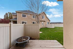 Exterior space featuring a deck and an outdoor fire pit