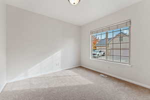 Empty room with carpet floors