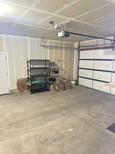 Garage featuring a garage door opener